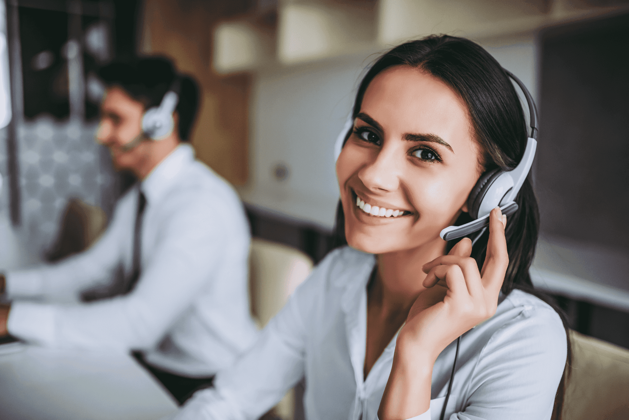 Smiling IT support agent with headset,